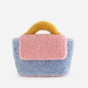 Mlouye shearling teddy transformer handbag